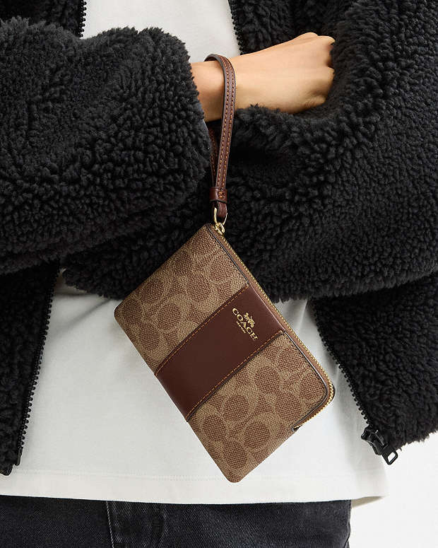 CARTERA DE MANO CON CREMALLERA COACH