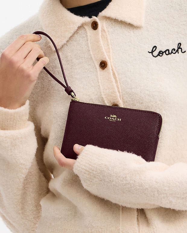 CARTERA DE MANO CON CREMALLERA COACH