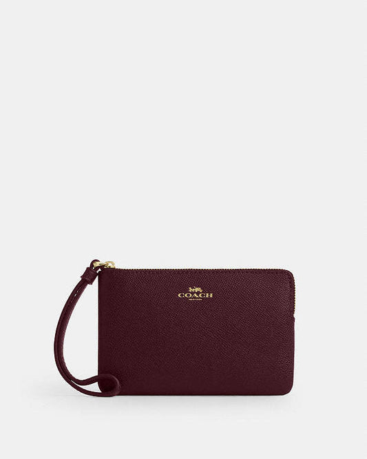 CARTERA DE MANO CON CREMALLERA COACH