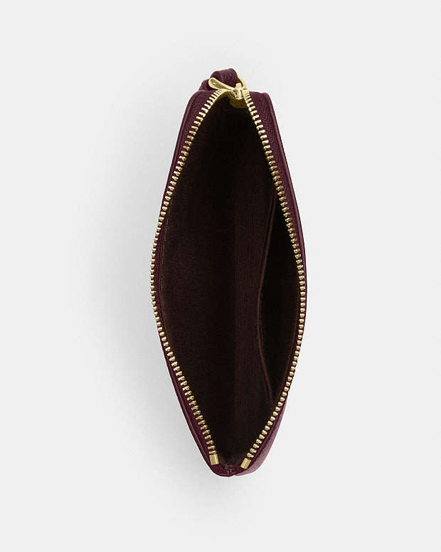 CARTERA DE MANO CON CREMALLERA COACH